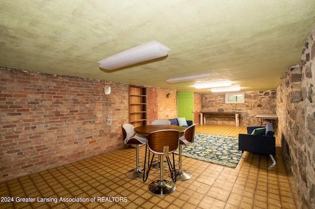 game room featuring a textured ceiling