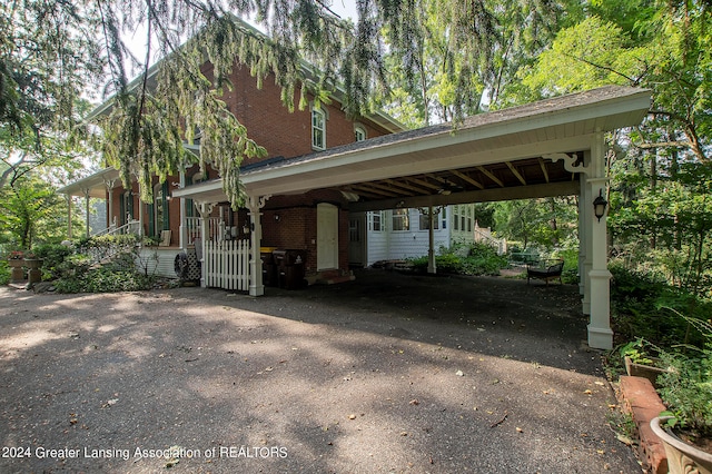 view of front of home with a carport