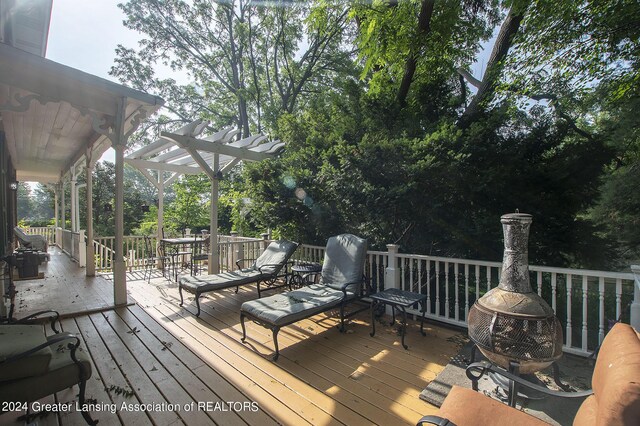 wooden terrace with a pergola