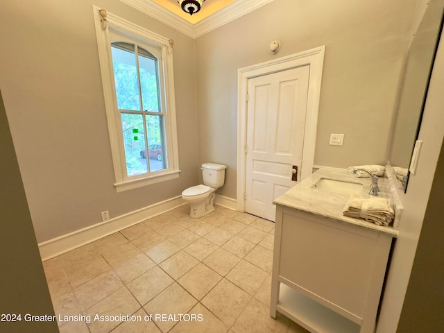 bathroom with crown molding, vanity, toilet, and plenty of natural light