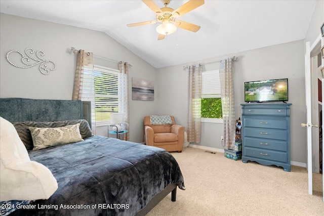 bedroom with carpet floors, vaulted ceiling, and ceiling fan