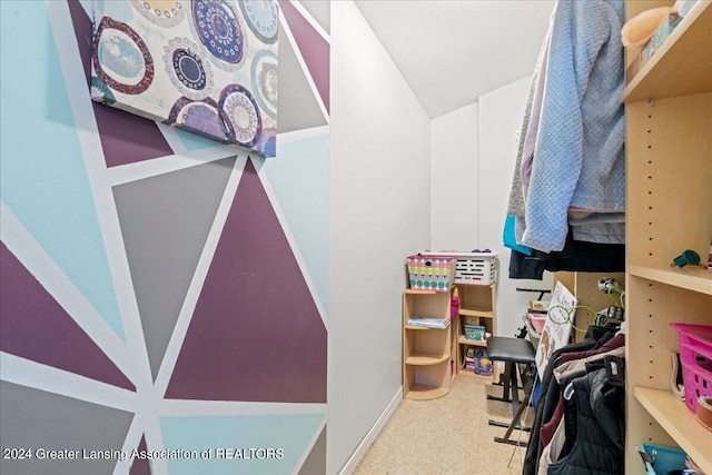 spacious closet with carpet floors