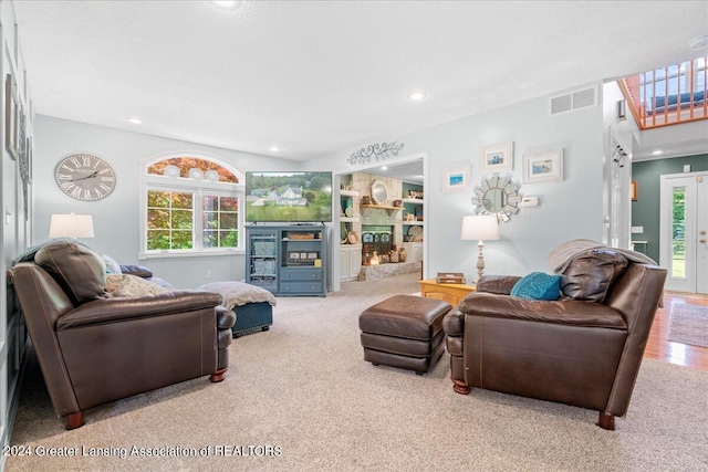 carpeted living room with a healthy amount of sunlight