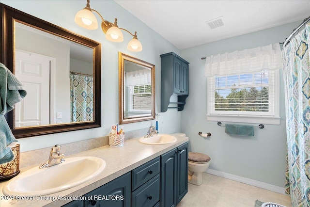 bathroom featuring vanity and toilet