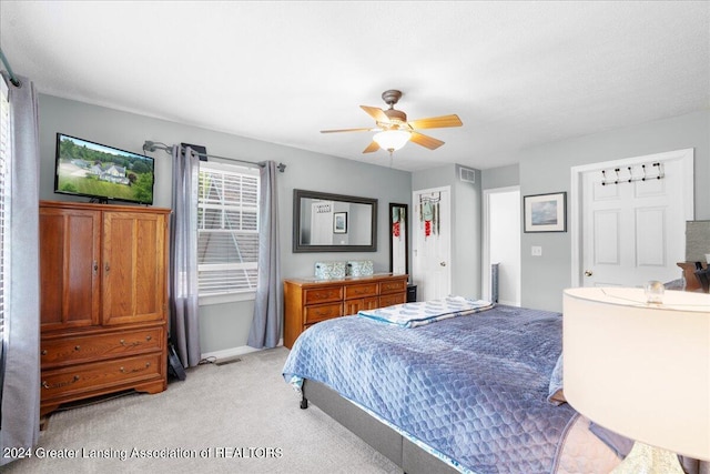 carpeted bedroom featuring ceiling fan