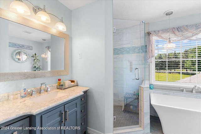 bathroom with plus walk in shower and vanity