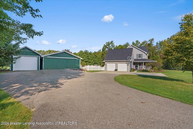 view of front of house featuring a front yard and a garage