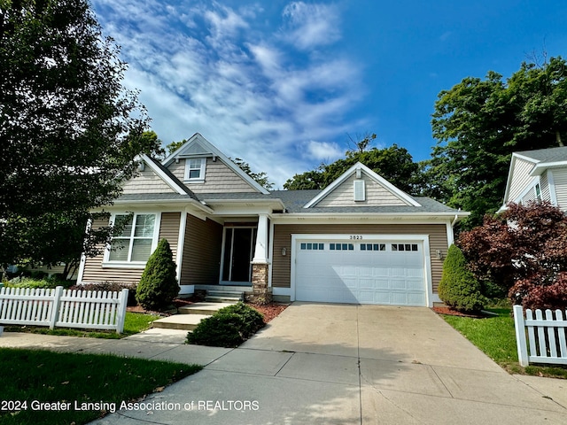 craftsman-style home with a garage