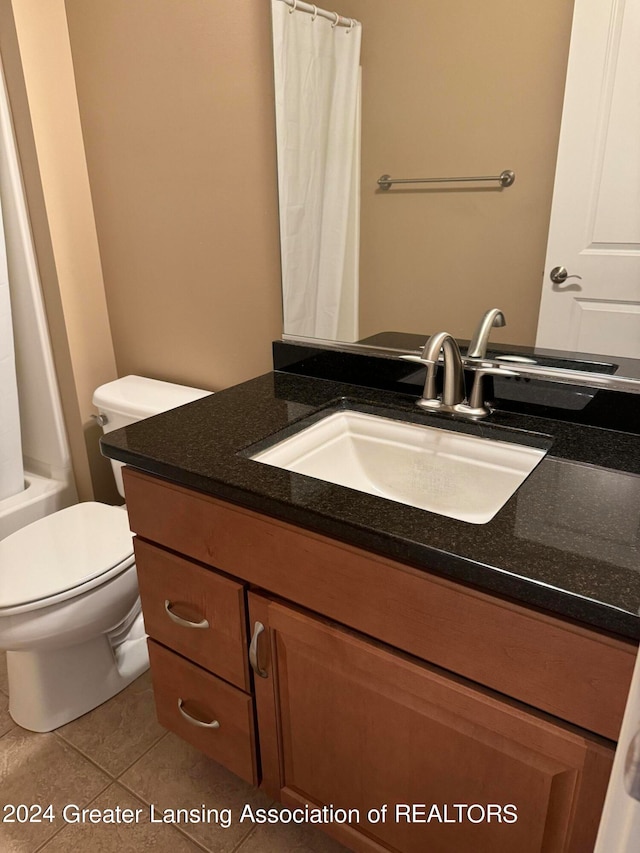 full bathroom with vanity, toilet, tile patterned floors, and shower / bathtub combination with curtain