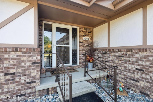 view of exterior entry with covered porch