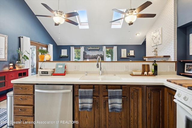 kitchen featuring high vaulted ceiling, ceiling fan, dishwasher, and sink