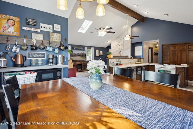 dining room featuring high vaulted ceiling, ceiling fan, hardwood / wood-style flooring, and beamed ceiling