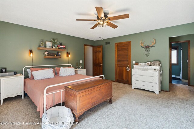 bedroom with ceiling fan and carpet