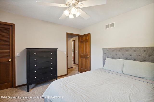 bedroom with light colored carpet and ceiling fan