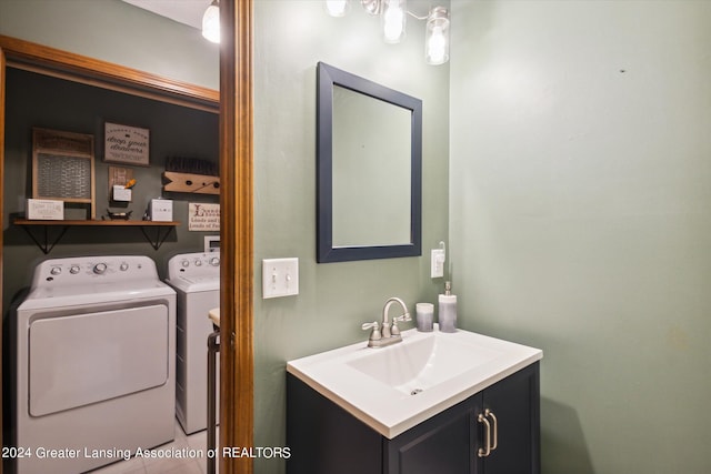 bathroom with vanity and independent washer and dryer