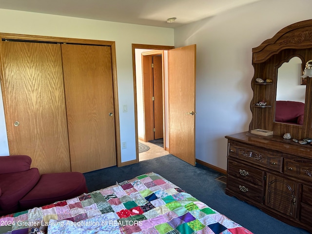 carpeted bedroom featuring a closet