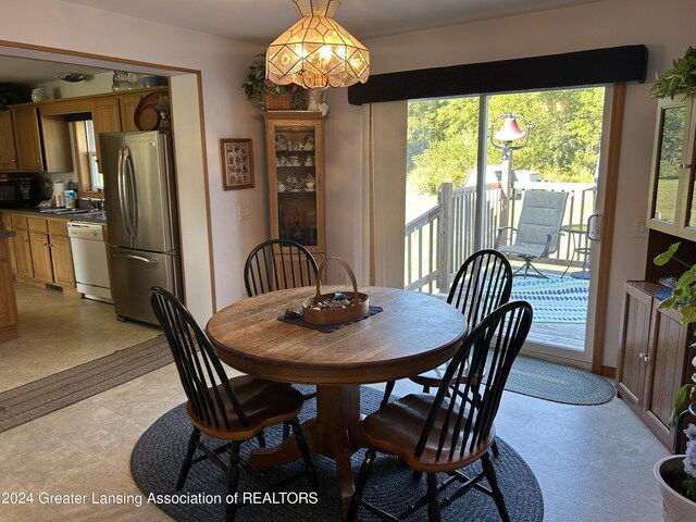 dining space featuring a notable chandelier and a wealth of natural light