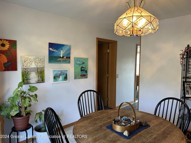 dining space featuring an inviting chandelier