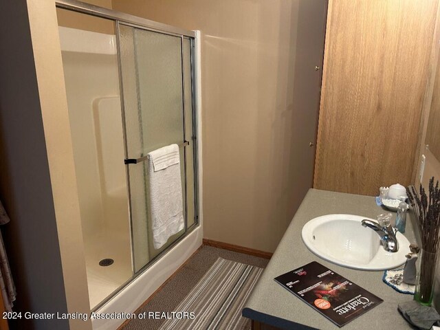 bathroom featuring vanity and walk in shower