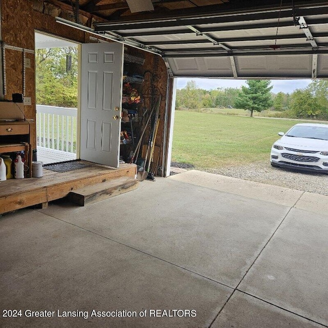 garage featuring a lawn