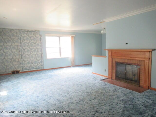 unfurnished living room with crown molding and carpet