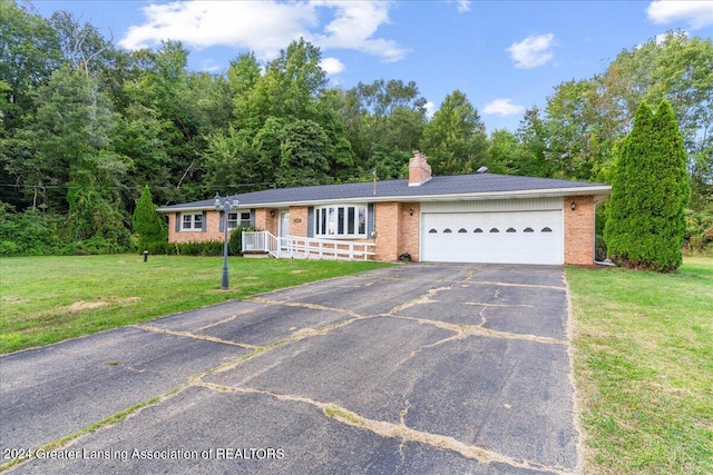 single story home with a garage and a front yard