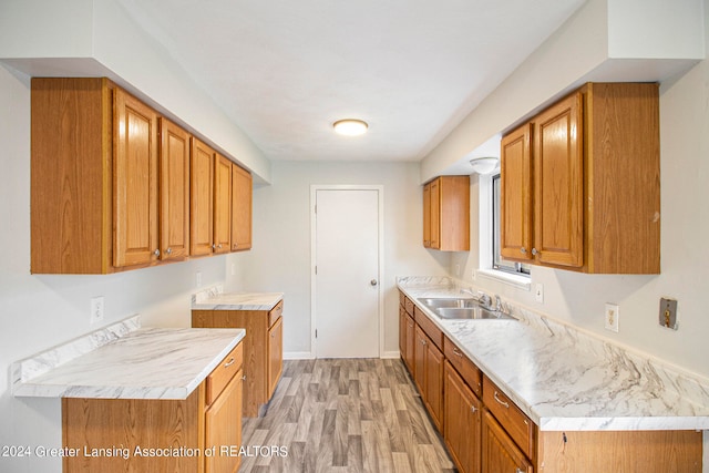 kitchen featuring light hardwood / wood-style flooring and sink