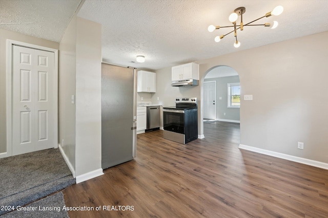 kitchen with a textured ceiling, stainless steel appliances, dark hardwood / wood-style flooring, an inviting chandelier, and white cabinets