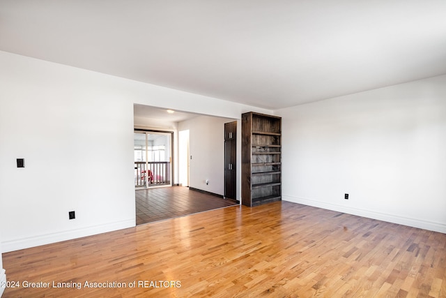 unfurnished room featuring hardwood / wood-style flooring