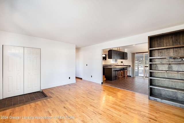 unfurnished living room featuring hardwood / wood-style floors