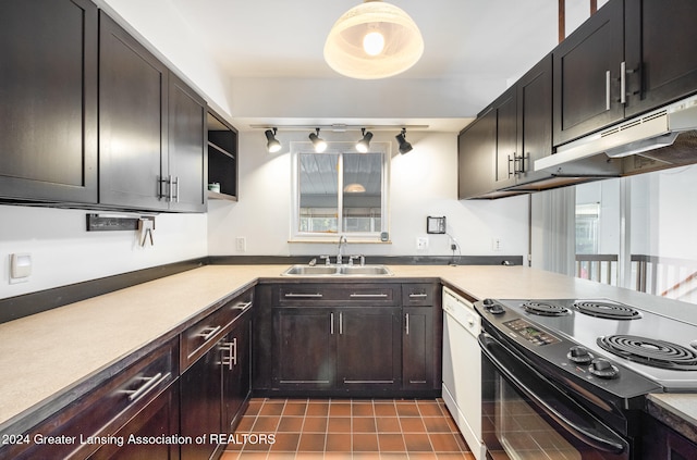 kitchen featuring dishwasher, black electric range oven, sink, dark tile patterned floors, and dark brown cabinets