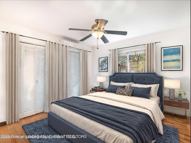 bedroom featuring light hardwood / wood-style floors and ceiling fan