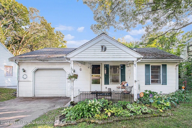 view of front facade featuring a garage and covered porch