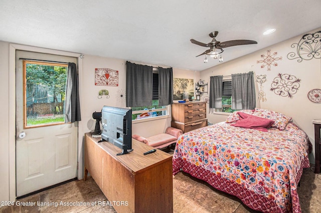 bedroom featuring ceiling fan and vaulted ceiling