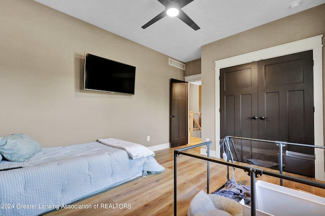 bedroom featuring ceiling fan and light hardwood / wood-style floors