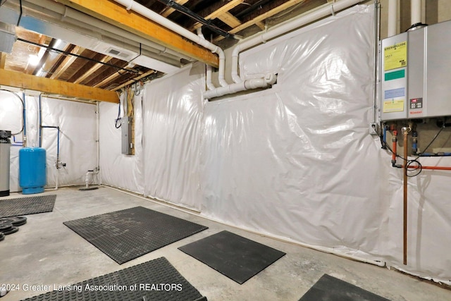 basement featuring tankless water heater