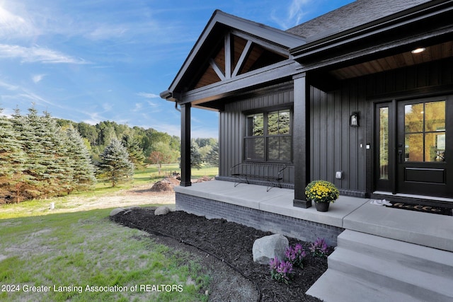 entrance to property with a yard