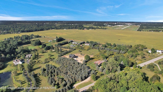 birds eye view of property with a rural view