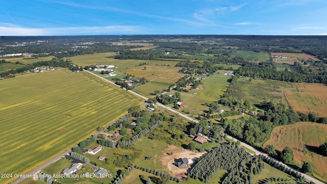 birds eye view of property with a rural view