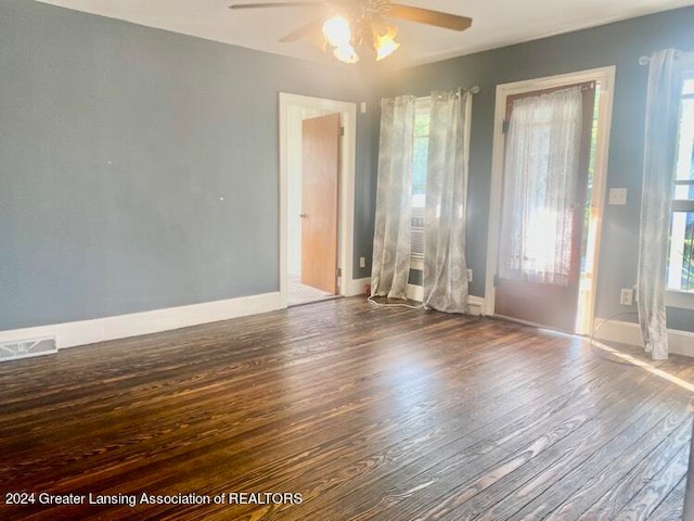 interior space featuring ceiling fan and dark wood-type flooring