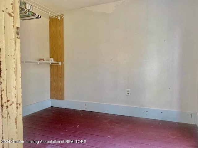 empty room with hardwood / wood-style floors