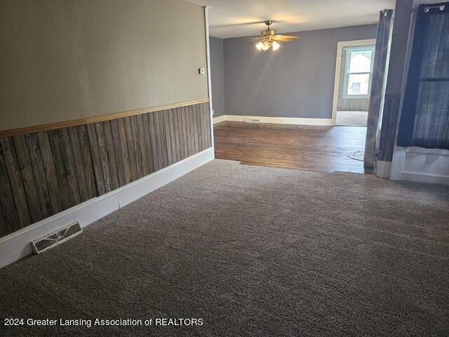 unfurnished room with wood-type flooring and ceiling fan