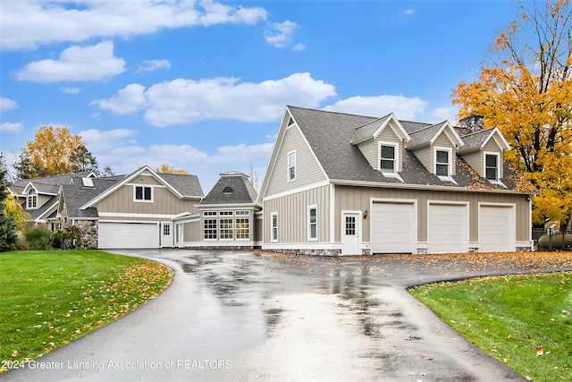 new england style home featuring a front lawn