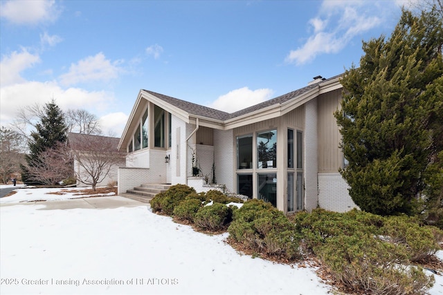 view of snow covered property