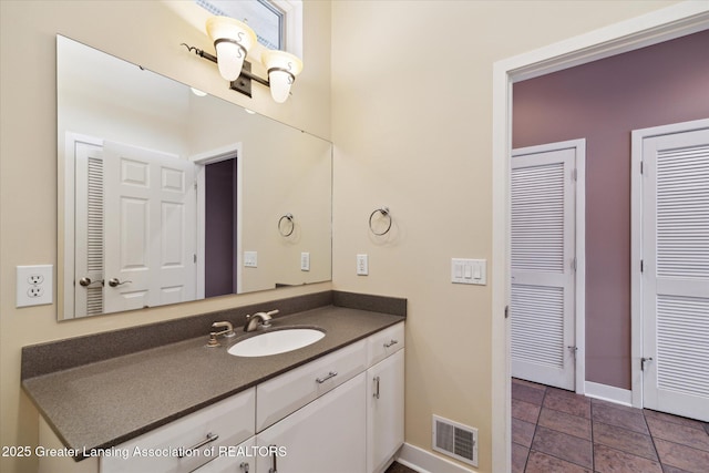 bathroom featuring vanity and tile patterned flooring