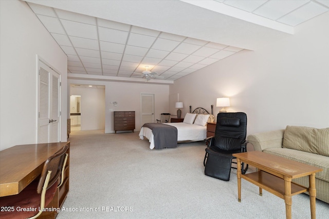 carpeted bedroom featuring a paneled ceiling