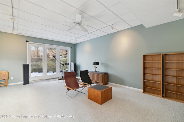 office area with light carpet, rail lighting, and ceiling fan