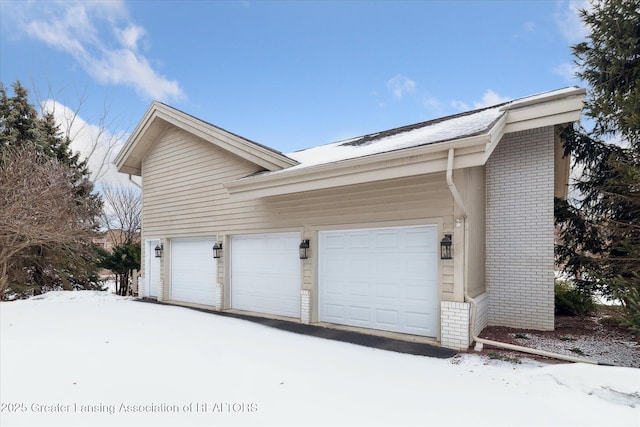 view of snow covered garage