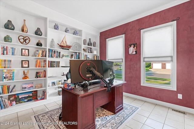 office space featuring crown molding and light tile patterned flooring