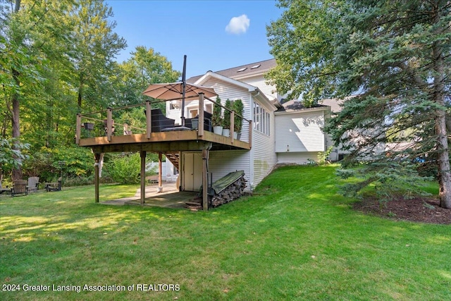 back of house with a yard and a wooden deck